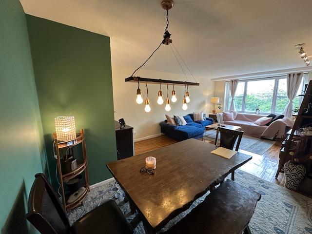 18-65 211th St Unit 5D, Bayside, NY 11360 - dining space with wood finished floors
