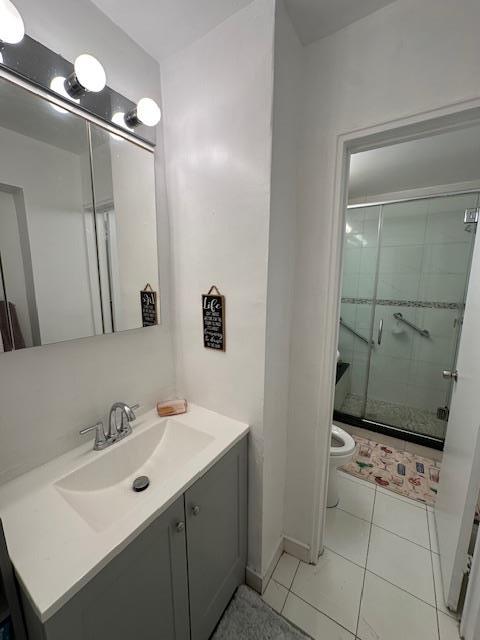 18-65 211th St Unit 5D, Bayside, NY 11360 - full bath featuring vanity, a shower stall, and tile patterned flooring
