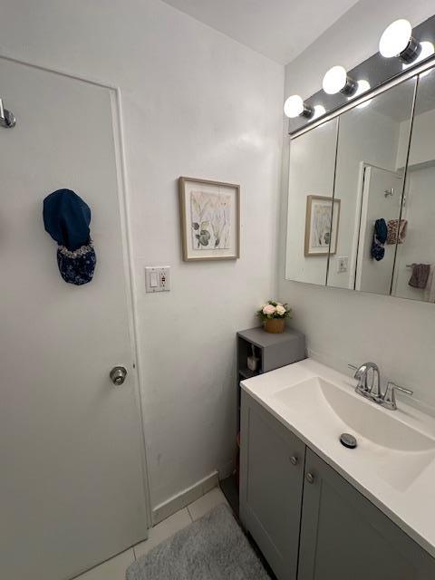 18-65 211th St Unit 5D, Bayside, NY 11360 - bathroom with vanity and tile patterned flooring