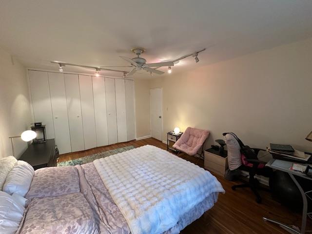 18-65 211th St Unit 5D, Bayside, NY 11360 - bedroom featuring track lighting, wood finished floors, and a ceiling fan