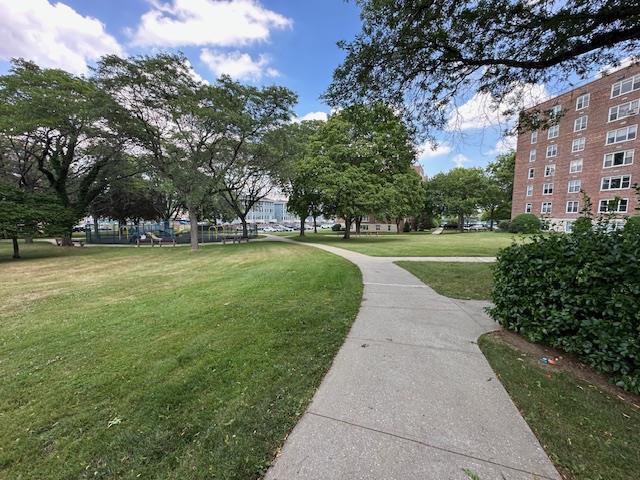 18-65 211th St Unit 5D, Bayside, NY 11360 - surrounding community with a yard