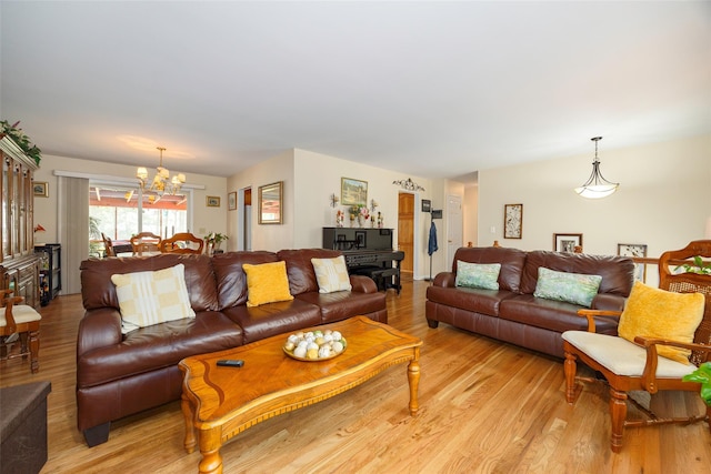 9 Malstorme Rd, Wappingers Falls, NY 12590 - living room featuring a chandelier and light wood-style floors
