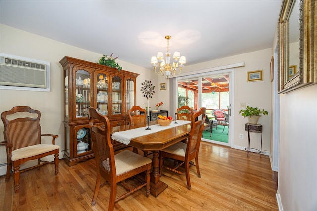 9 Malstorme Rd, Wappingers Falls, NY 12590 - dining space featuring a chandelier, light wood-style floors, and a wall unit AC