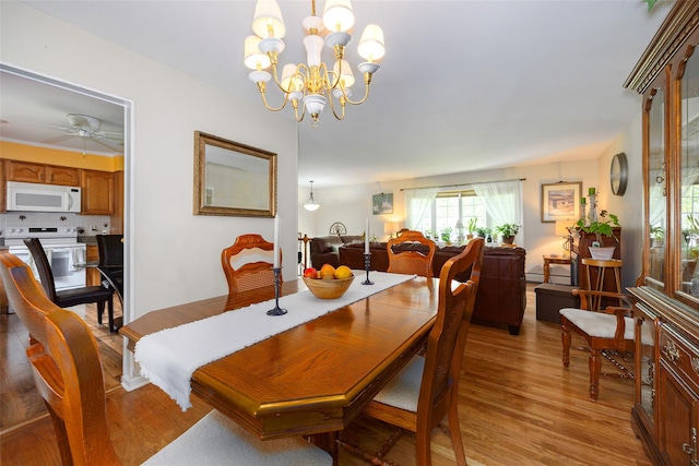 9 Malstorme Rd, Wappingers Falls, NY 12590 - dining space with light wood-type flooring, a chandelier, and ceiling fan