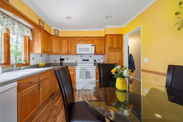 9 Malstorme Rd, Wappingers Falls, NY 12590 - kitchen with white appliances, brown cabinetry, dark wood-type flooring, ornamental molding, and decorative backsplash