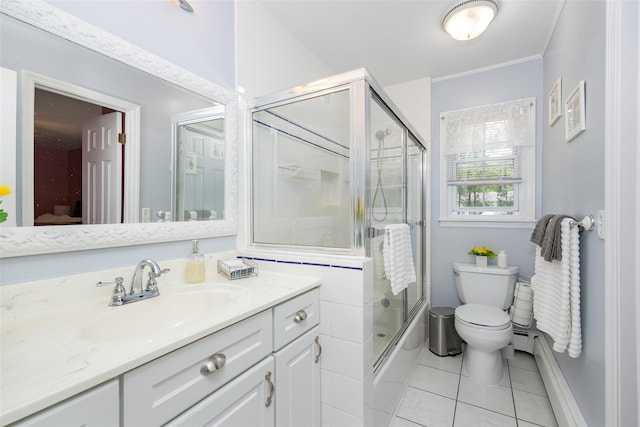 9 Malstorme Rd, Wappingers Falls, NY 12590 - bathroom with vanity, tile patterned floors, bath / shower combo with glass door, crown molding, and a baseboard heating unit