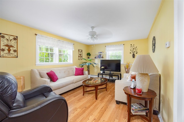 9 Malstorme Rd, Wappingers Falls, NY 12590 - living area featuring light wood-style floors, ceiling fan, and a baseboard radiator