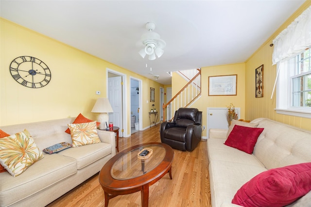 9 Malstorme Rd, Wappingers Falls, NY 12590 - living room featuring wood finished floors, stairway, and a ceiling fan