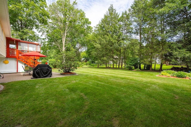 9 Malstorme Rd, Wappingers Falls, NY 12590 - view of grassy yard with a patio area, stairs, and view of wooded area