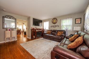 20 Wainwright St, Ronkonkoma, NY 11779 - living area featuring wood finished floors