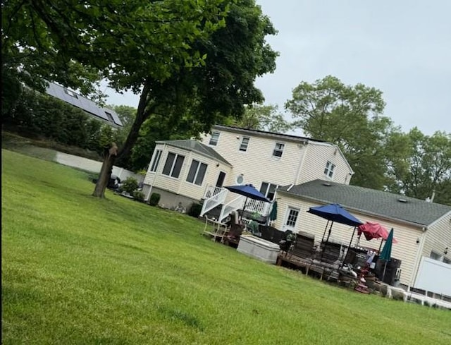 20 Wainwright St, Ronkonkoma, NY 11779 - rear view of house with a wooden deck and a gazebo
