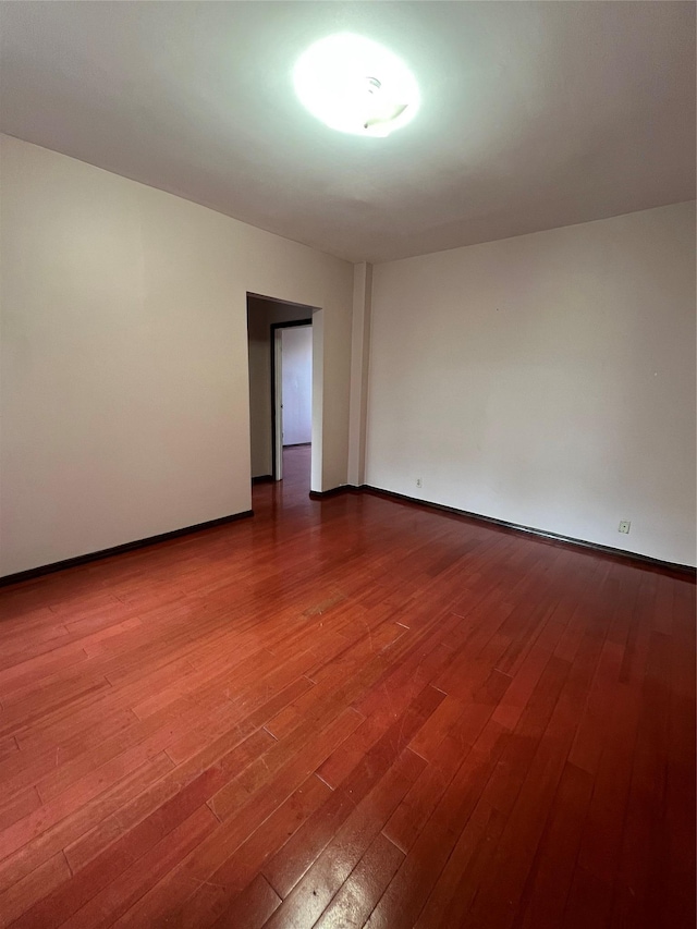 38-05 65th St Unit 2F, Woodside, NY 11377 - empty room featuring wood-type flooring and baseboards