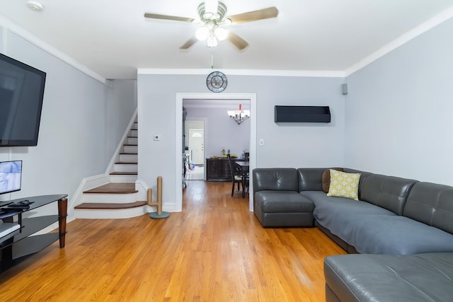 25-57 Mcintosh St, East Elmhurst, NY 11369 - living area with stairway, a ceiling fan, light wood-style flooring, crown molding, and a chandelier