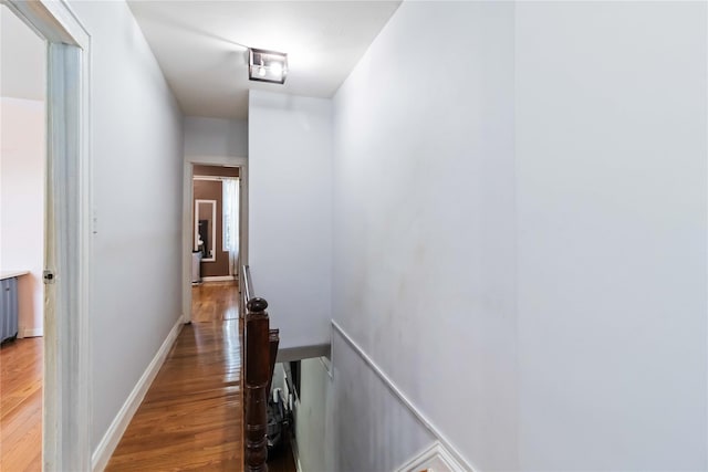 25-57 Mcintosh St, East Elmhurst, NY 11369 - hallway featuring wood finished floors and an upstairs landing
