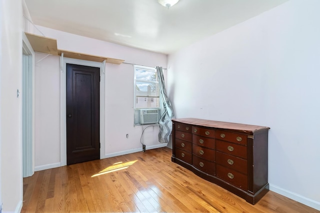 25-57 Mcintosh St, East Elmhurst, NY 11369 - entrance foyer with light wood finished floors and cooling unit