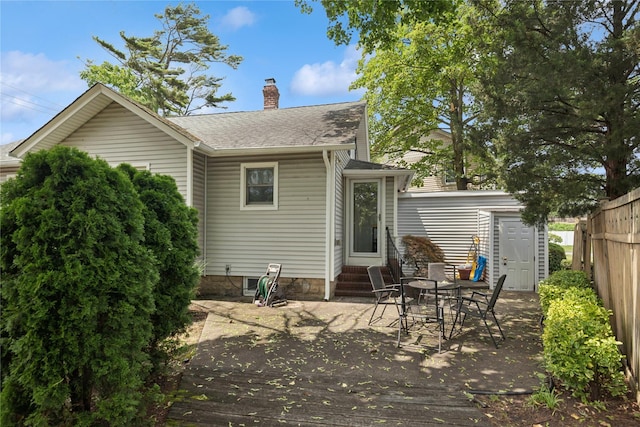 111 Little E Neck Rd, Babylon, NY 11702 - back of house with entry steps, a deck, a shingled roof, and a chimney