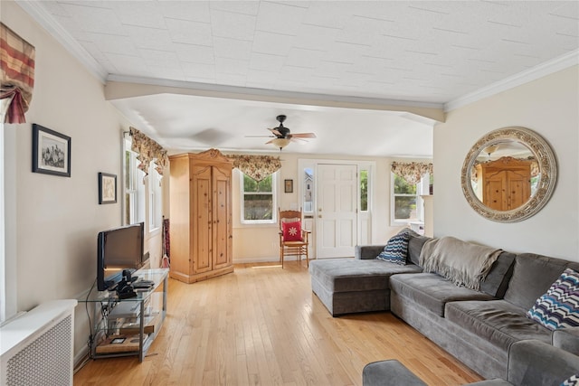 111 Little E Neck Rd, Babylon, NY 11702 - living room with light wood-type flooring, radiator heating unit, ornamental molding, and ceiling fan
