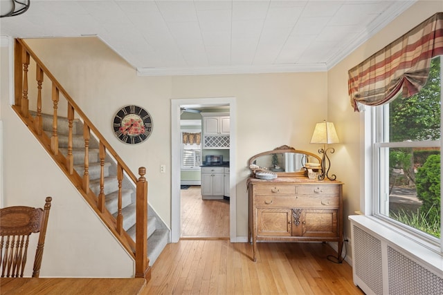 111 Little E Neck Rd, Babylon, NY 11702 - foyer with radiator heating unit, crown molding, light wood-style flooring, and stairs
