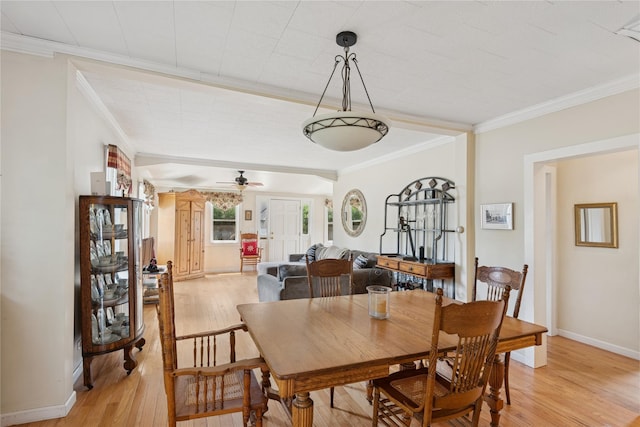 111 Little E Neck Rd, Babylon, NY 11702 - dining area with light wood finished floors, ornamental molding, and ceiling fan