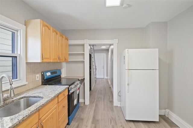 17 Schneider Ave, Highland Falls, NY 10928 - kitchen with freestanding refrigerator, electric stove, light stone counters, light wood-style flooring, and tasteful backsplash