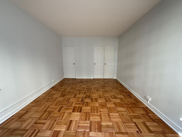 98-10 64th Ave Unit 2E, Rego Park, NY 11374 - unfurnished bedroom with baseboards