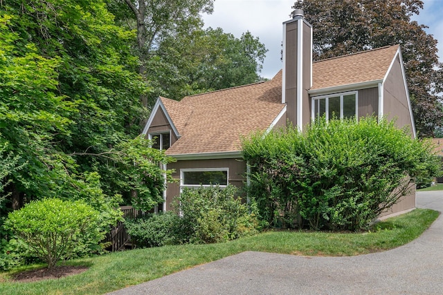 5 Grove Mews, Chappaqua, NY 10514 - view of home's exterior featuring a shingled roof and a chimney
