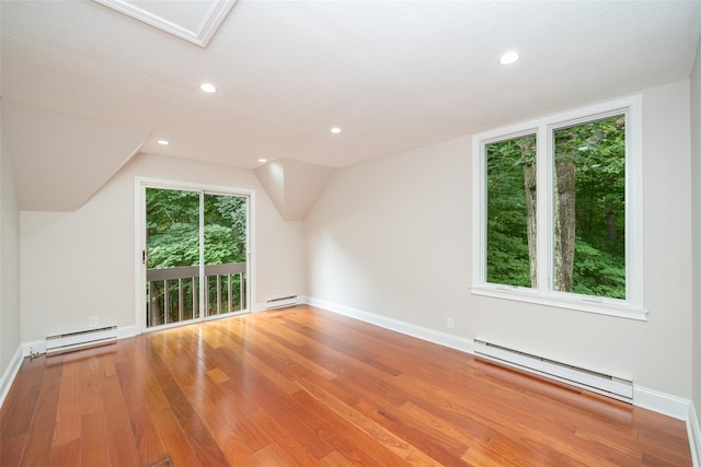5 Grove Mews, Chappaqua, NY 10514 - additional living space featuring a baseboard heating unit, light wood-style floors, recessed lighting, and vaulted ceiling