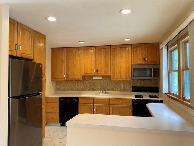 14 Shepard Rd, Warwick, NY 10990 - kitchen with stainless steel appliances, brown cabinetry, light countertops, backsplash, and recessed lighting
