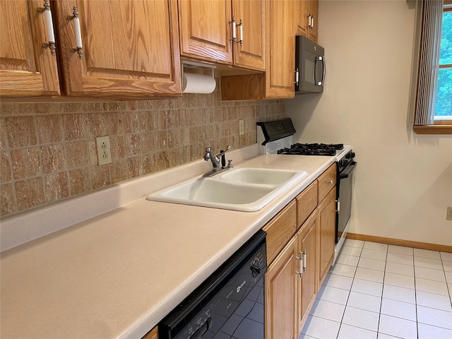 14 Shepard Rd, Warwick, NY 10990 - kitchen with black appliances, tasteful backsplash, light tile patterned floors, light countertops, and brown cabinetry