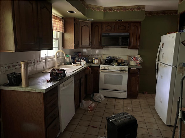 577 Wheeler Hill Rd, Wappingers Falls, NY 12590 - kitchen featuring white appliances, light tile patterned flooring, light countertops, and decorative backsplash
