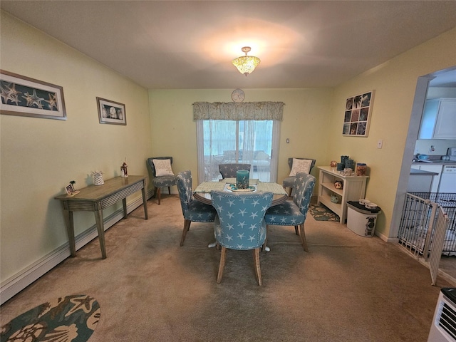 274 N Grand Ave, Poughkeepsie, NY 12603 - dining space with carpet and a baseboard radiator