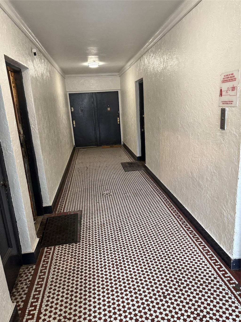 1185 Anderson Ave Unit 4B, Bronx, NY 10452 - hallway featuring a textured wall and ornamental molding
