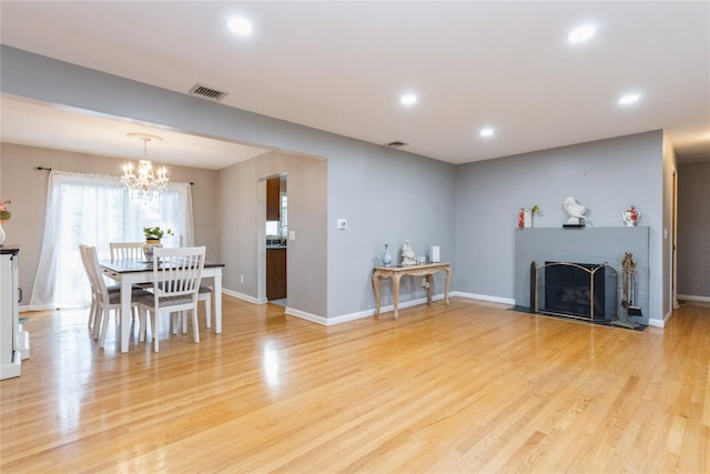 46 Laffin Ln, Poughkeepsie, NY 12603 - living room featuring a chandelier, light wood-style flooring, recessed lighting, and a fireplace with flush hearth