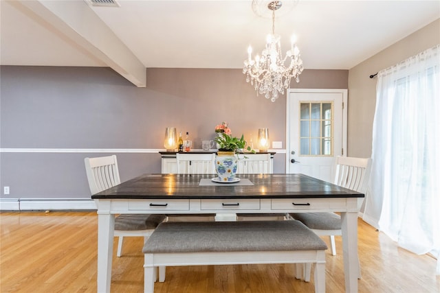 46 Laffin Ln, Poughkeepsie, NY 12603 - dining area featuring a baseboard radiator, a chandelier, light wood-type flooring, and beam ceiling