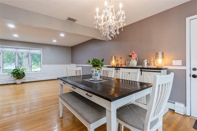 46 Laffin Ln, Poughkeepsie, NY 12603 - dining area featuring a chandelier, baseboard heating, light wood-type flooring, a wainscoted wall, and recessed lighting
