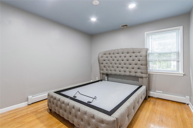 46 Laffin Ln, Poughkeepsie, NY 12603 - bedroom featuring a baseboard radiator, wood finished floors, and recessed lighting