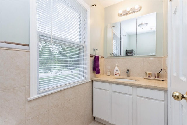 46 Laffin Ln, Poughkeepsie, NY 12603 - bathroom with vanity, tile walls, and tasteful backsplash