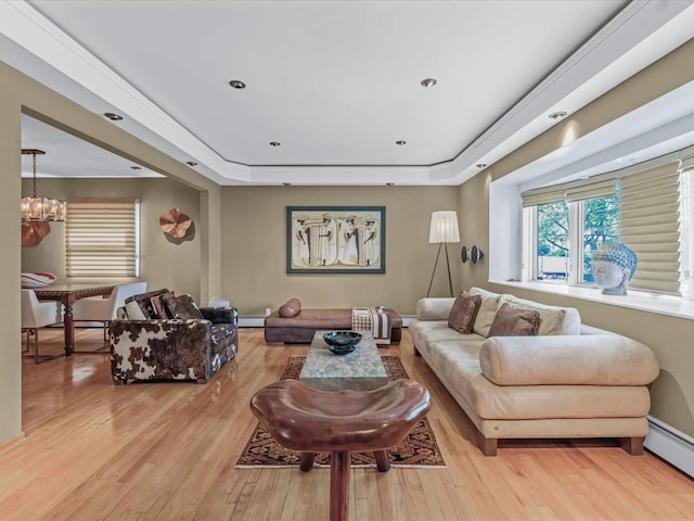 165-05 67th Ave, Fresh Meadows, NY 11365 - living room with a baseboard radiator, wood finished floors, a chandelier, and a tray ceiling
