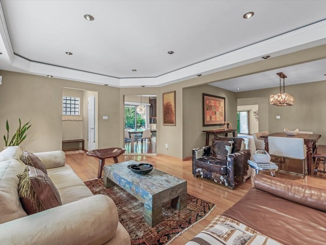 165-05 67th Ave, Fresh Meadows, NY 11365 - living room featuring light wood-style floors, a chandelier, a raised ceiling, and recessed lighting