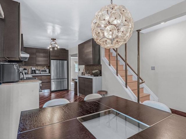 165-05 67th Ave, Fresh Meadows, NY 11365 - dining room with a chandelier, stairway, and dark wood finished floors
