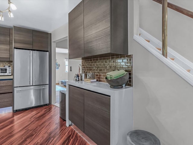 165-05 67th Ave, Fresh Meadows, NY 11365 - kitchen featuring high end refrigerator, modern cabinets, backsplash, light countertops, and dark wood-style flooring