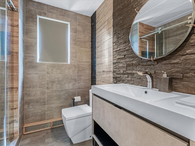 165-05 67th Ave, Fresh Meadows, NY 11365 - full bath featuring tile walls, vanity, a shower stall, and tile patterned floors