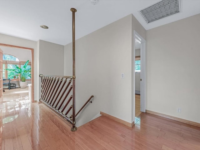 165-05 67th Ave, Fresh Meadows, NY 11365 - corridor featuring an upstairs landing, light wood-style flooring, and healthy amount of natural light