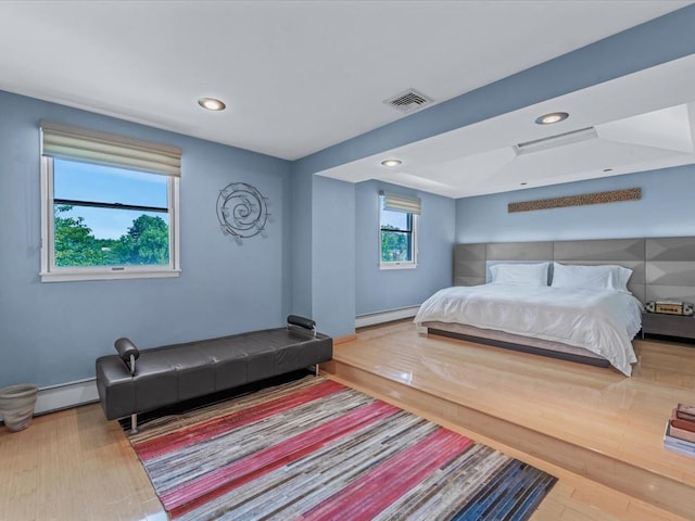 165-05 67th Ave, Fresh Meadows, NY 11365 - bedroom with recessed lighting, a baseboard radiator, and wood finished floors