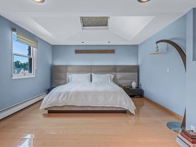 165-05 67th Ave, Fresh Meadows, NY 11365 - bedroom with a raised ceiling, wood finished floors, and a baseboard heating unit