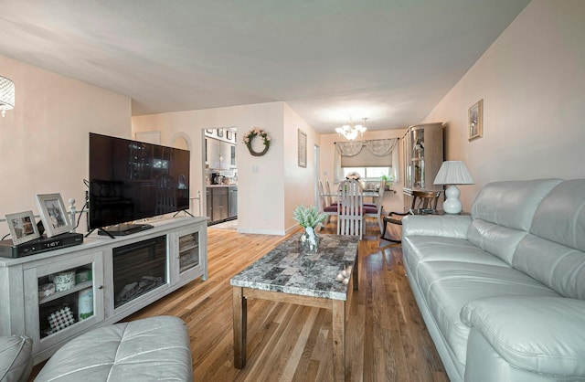 26 Comanche, Commack, NY 11725 - living area featuring a chandelier and light wood-type flooring