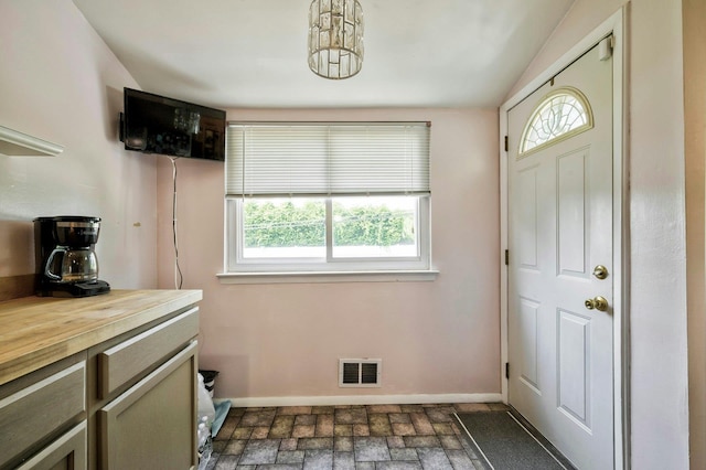 26 Comanche, Commack, NY 11725 - foyer featuring baseboards and brick patterned floors
