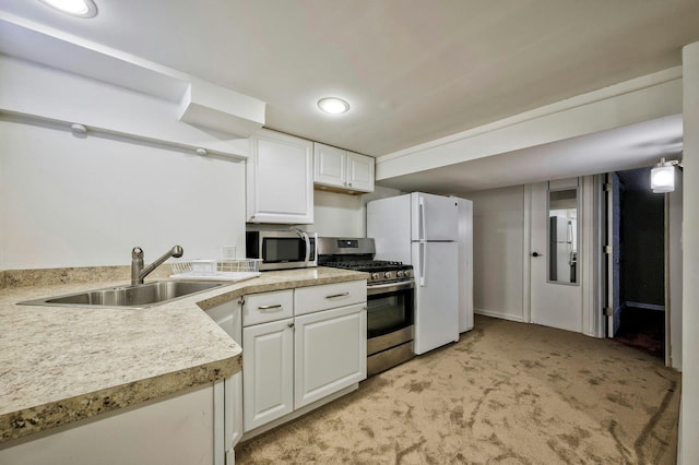 26 Comanche, Commack, NY 11725 - kitchen featuring appliances with stainless steel finishes, light colored carpet, white cabinetry, light countertops, and recessed lighting