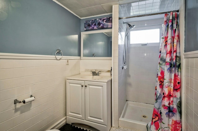 26 Comanche, Commack, NY 11725 - bathroom featuring tile walls, a shower stall, vanity, a wainscoted wall, and crown molding