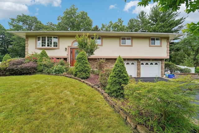 30 Birchwood Ter, Nanuet, NY 10954 - split foyer home featuring stucco siding, a garage, asphalt driveway, and a front lawn